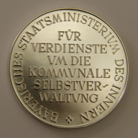 komm verdienst quadrat